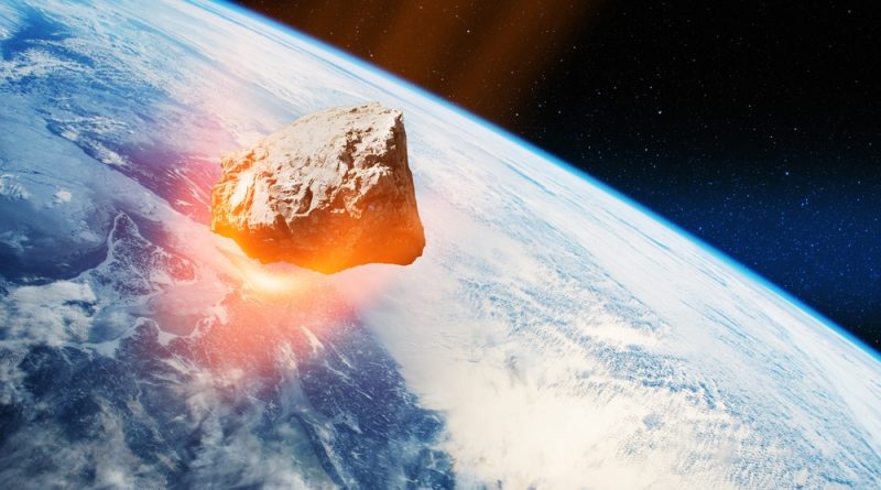 An asteroid in space with the planet earth in the background
