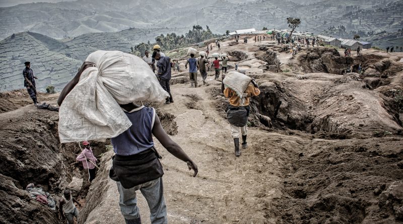 Mining operations in the Democratic Republic of Congo surrounded by security personnel and industrial infrastructure tied to critical mineral extraction.